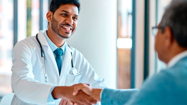 Doctor shakes hands with patient
